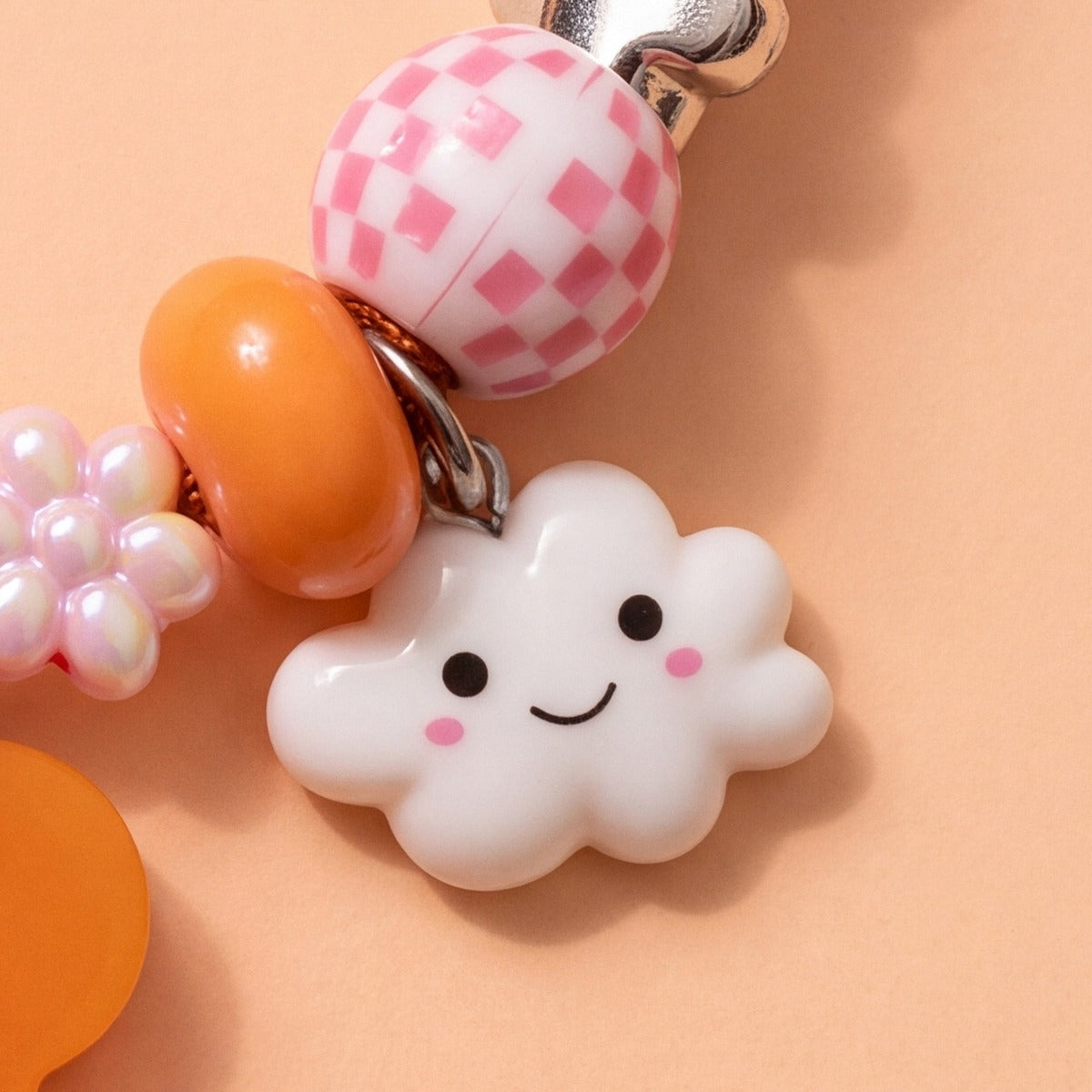 BEADBOO Happy Cloud charm hanging on a handmade beaded dog collar [crop:charm-cloud__javier]