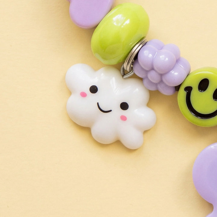 BEADBOO Happy Cloud charm hanging on a handmade beaded dog collar [crop:charm-cloud__penny]