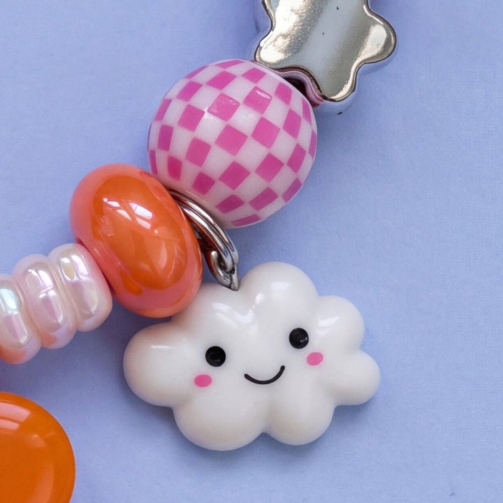 BEADBOO Happy Cloud charm hanging on a handmade beaded dog collar [crop:charm-cloud__willie-jack]