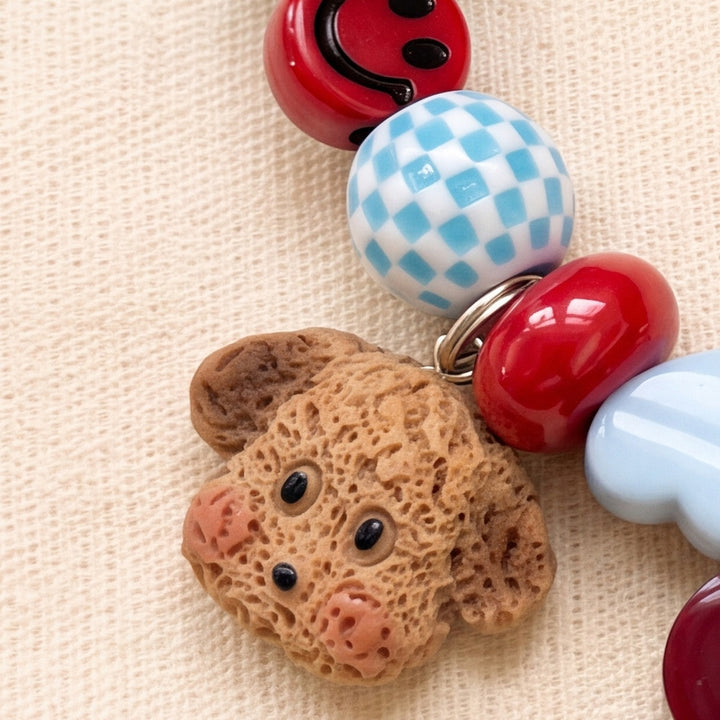 BEADBOO Cozy Puppy charm hanging on a handmade beaded dog collar [crop:charm-crochet-puppy__francesco]