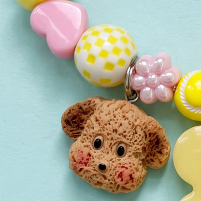 BEADBOO Cozy Puppy charm hanging on a handmade beaded dog collar [crop:charm-crochet-puppy__noori]