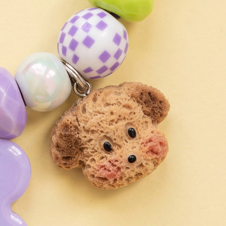 BEADBOO Cozy Puppy charm hanging on a handmade beaded dog collar [crop:charm-crochet-puppy__penny]