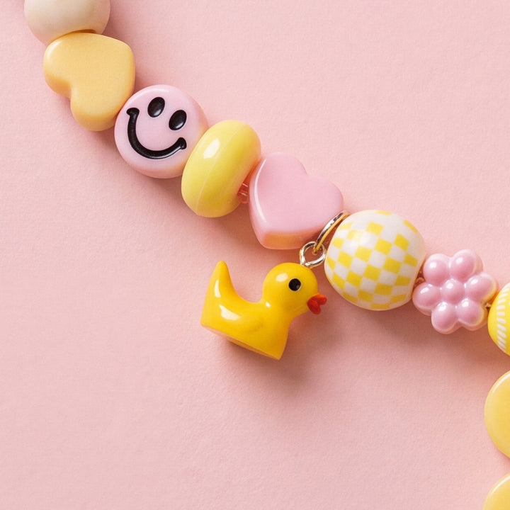 BEADBOO Rubber Ducky charm hanging on a handmade beaded dog collar [crop:charm-duck__kanima]