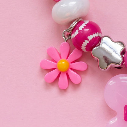 BEADBOO Pink Daisy charm hanging on a handmade beaded dog collar [crop:charm-flower-pink__kkuymi]