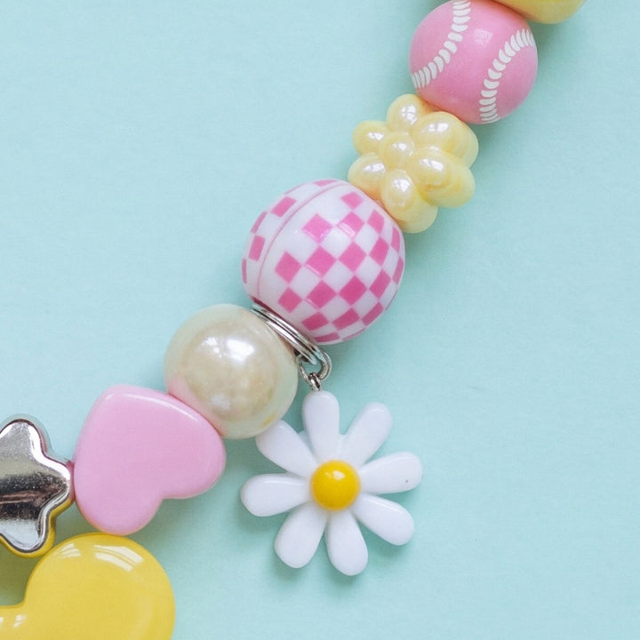 BEADBOO White Daisy charm hanging on a handmade beaded dog collar [crop:charm-flower-white__frankie]
