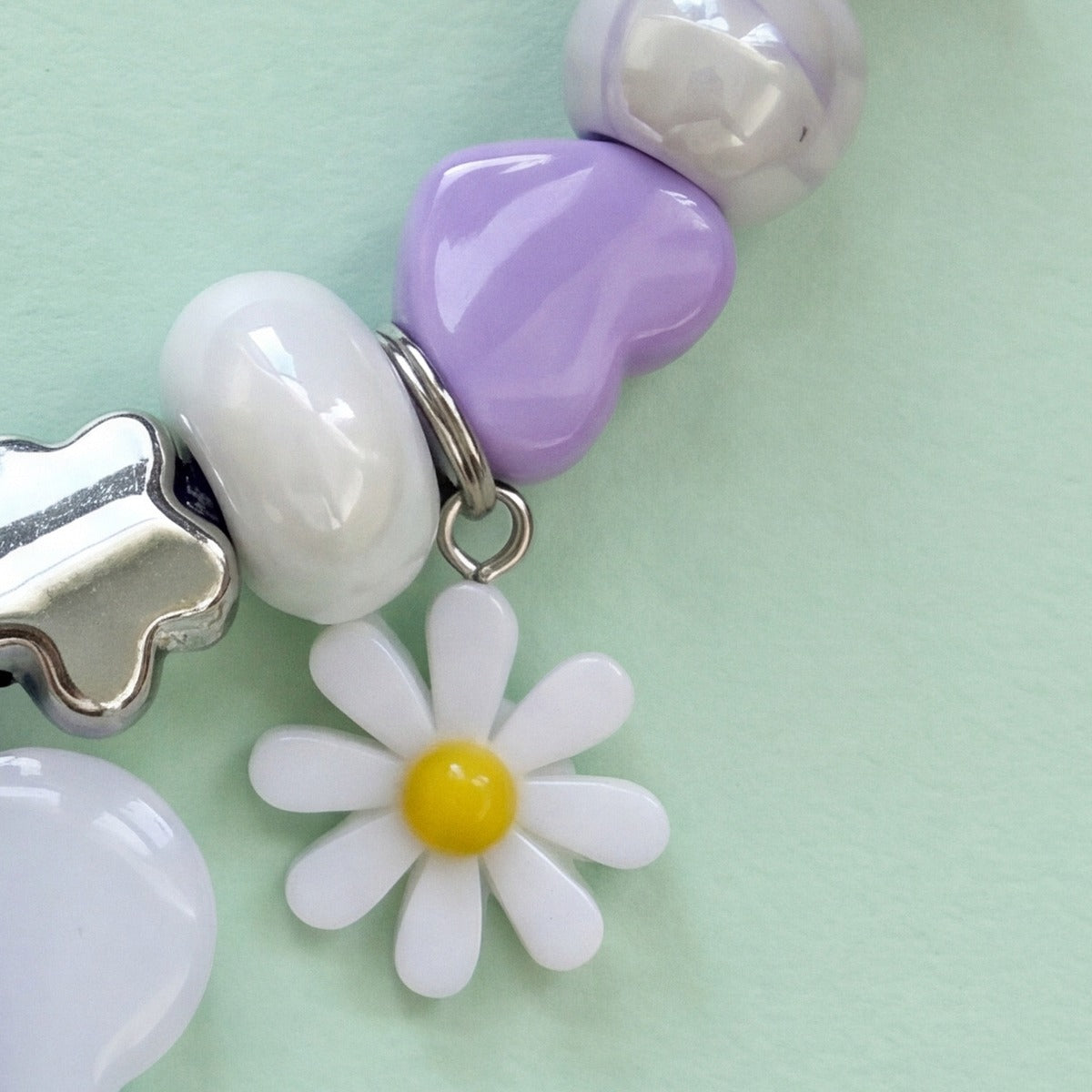 BEADBOO White Daisy charm hanging on a handmade beaded dog collar [crop:charm-flower-white__luna-purple]