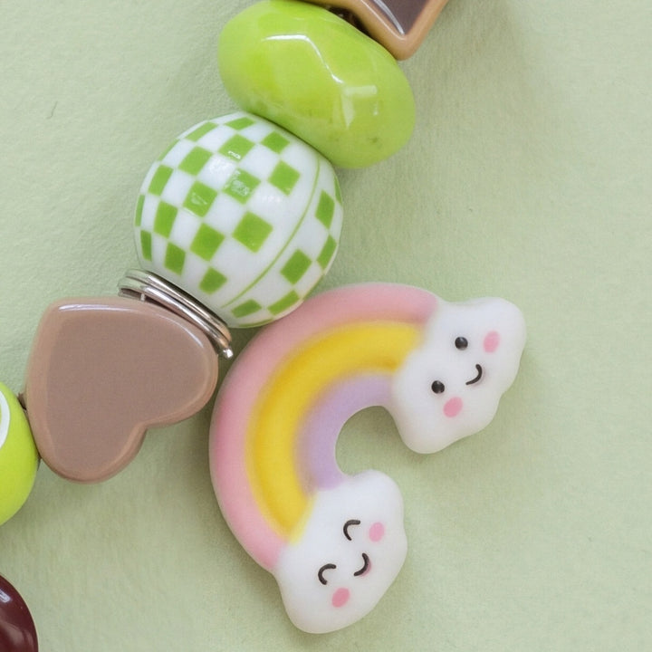 BEADBOO Rainbow charm hanging on a handmade beaded dog collar [crop:charm-rainbow__kiwi]