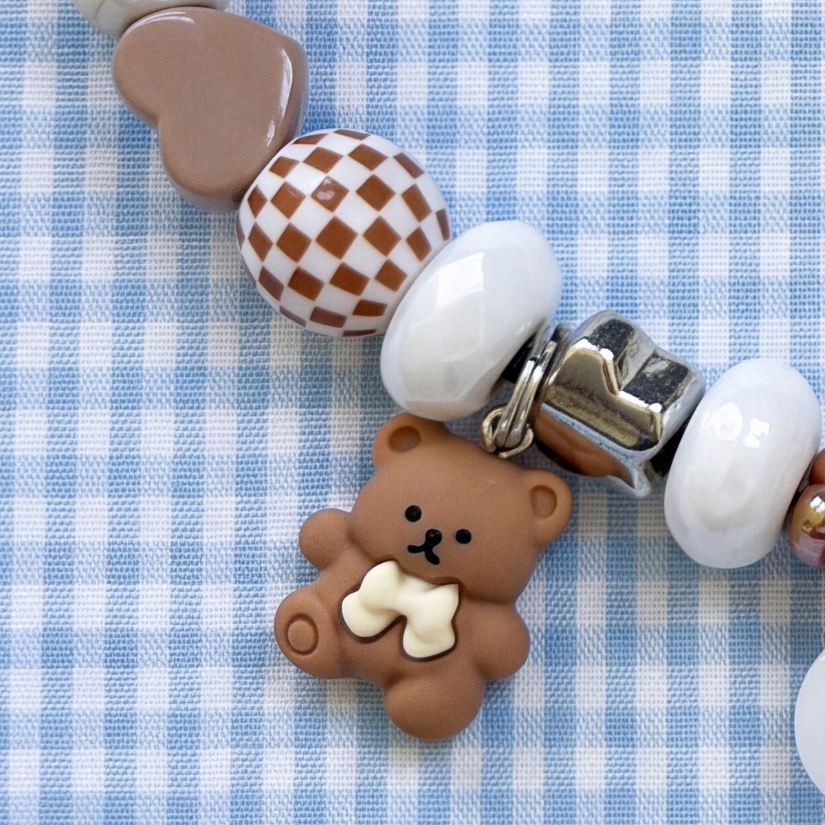BEADBOO Honey Teddy charm hanging on a handmade beaded dog collar [crop:charm-teddy-bear__charlie-L]