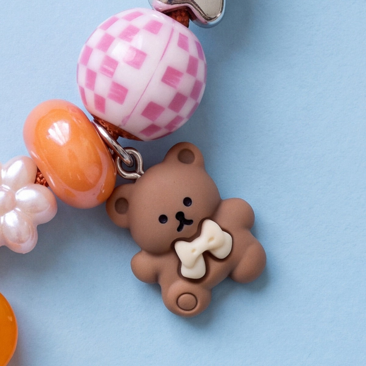BEADBOO Honey Teddy charm hanging on a handmade beaded dog collar [crop:charm-teddy-bear__winnie]