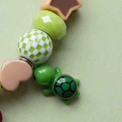 BEADBOO Tiny Turtle charm hanging on a handmade beaded dog collar [crop:charm-turtle__ebizzz]