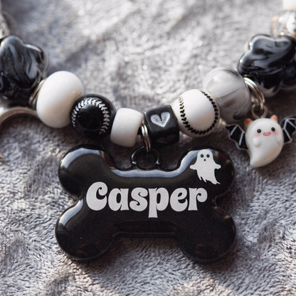 Ghostling beaded dog necklace — black and white beads, silver moon and ghost charms, black bone name tag