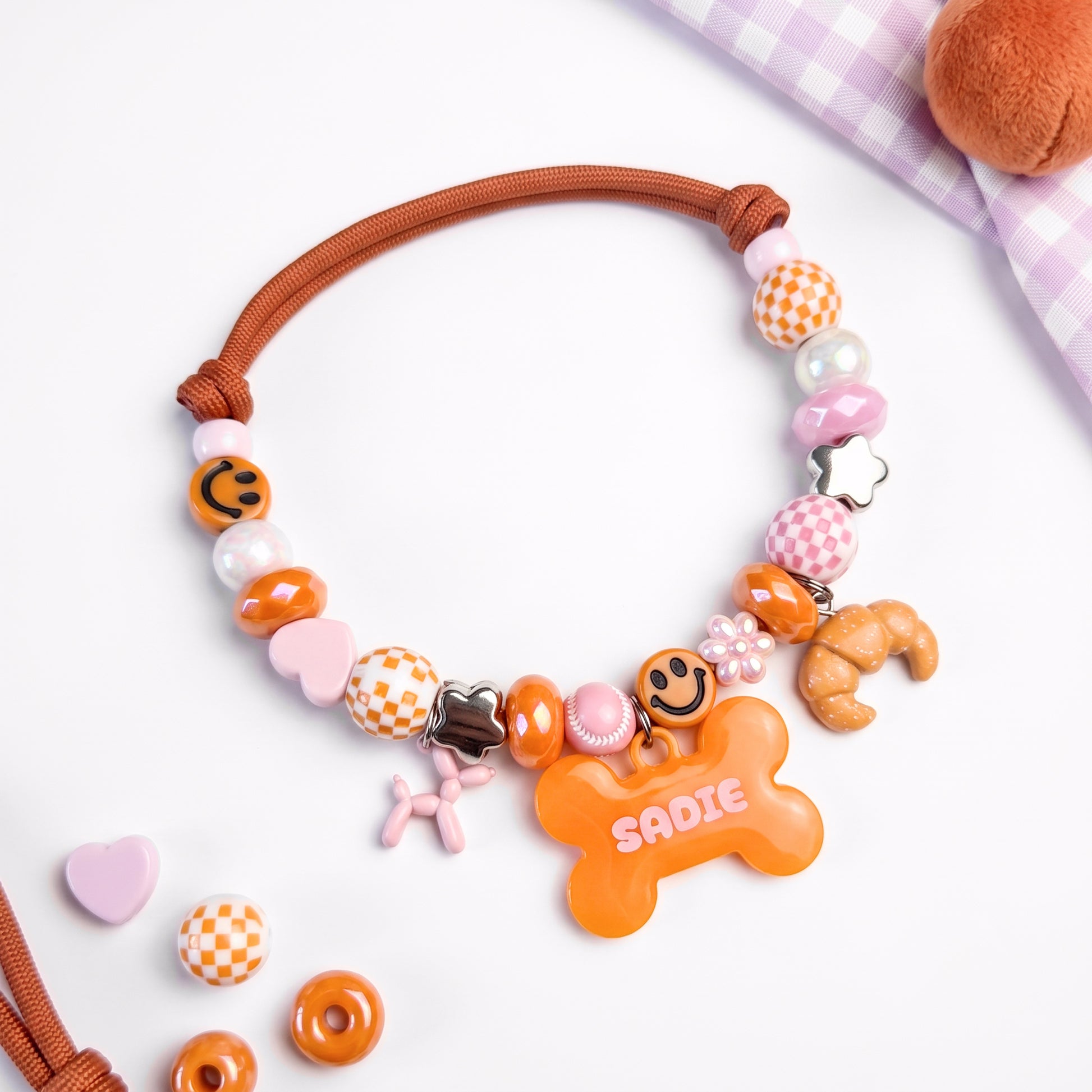 Foxy Roxy orange beaded dog collar necklace with bone name tag