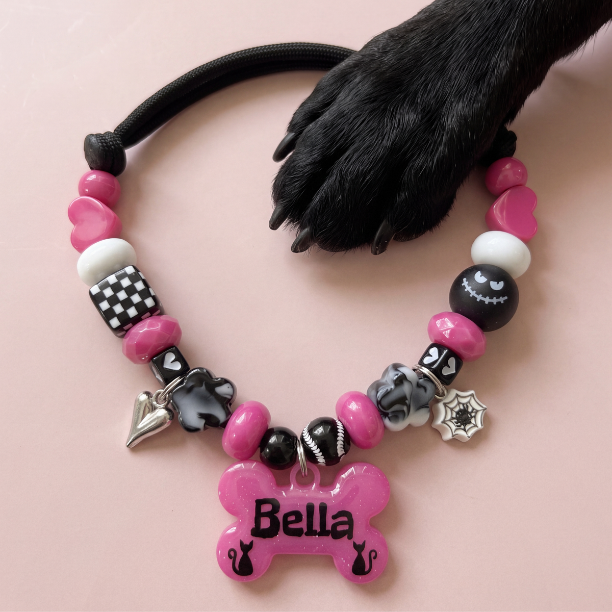 Witchy Whiskers beaded dog necklace — hot pink and black beads, silver heart and spiderweb charms, glittery pink bone name tag